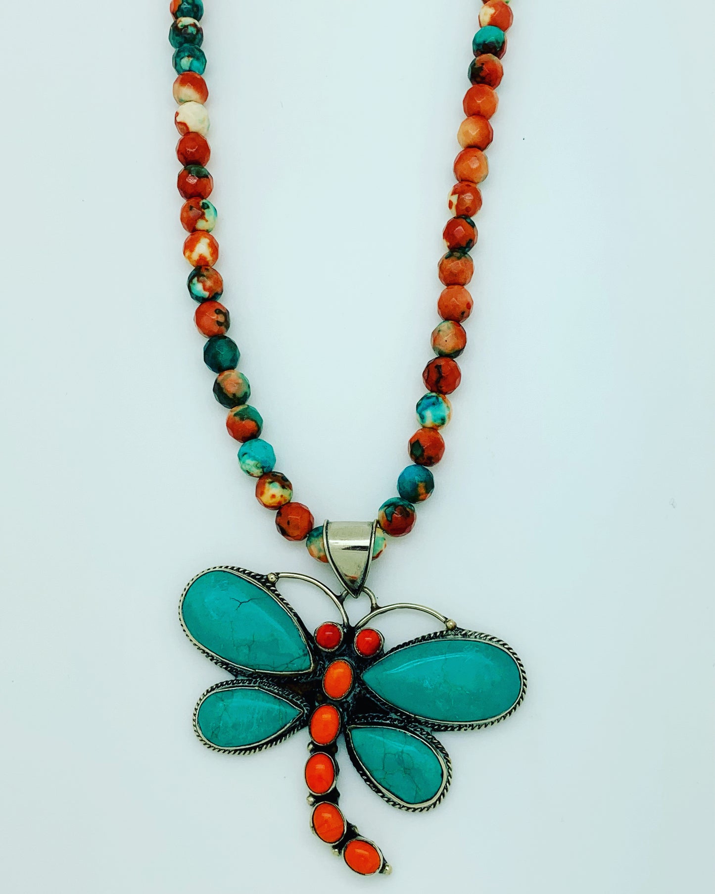 Orange, turquoise and white howlite beads with Tibetan dragonfly