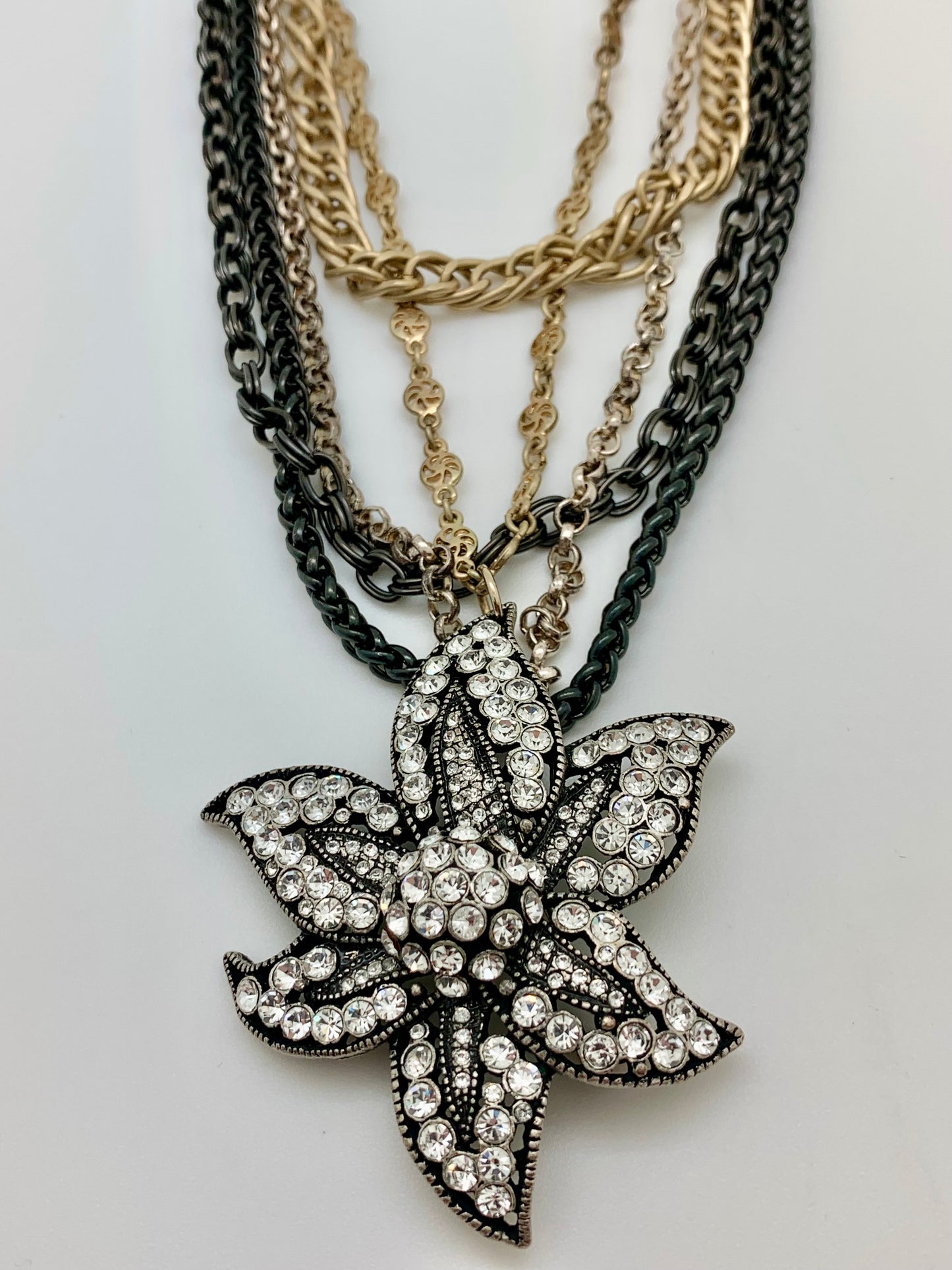 5 strand multi colored chain with crystal encrusted brooch