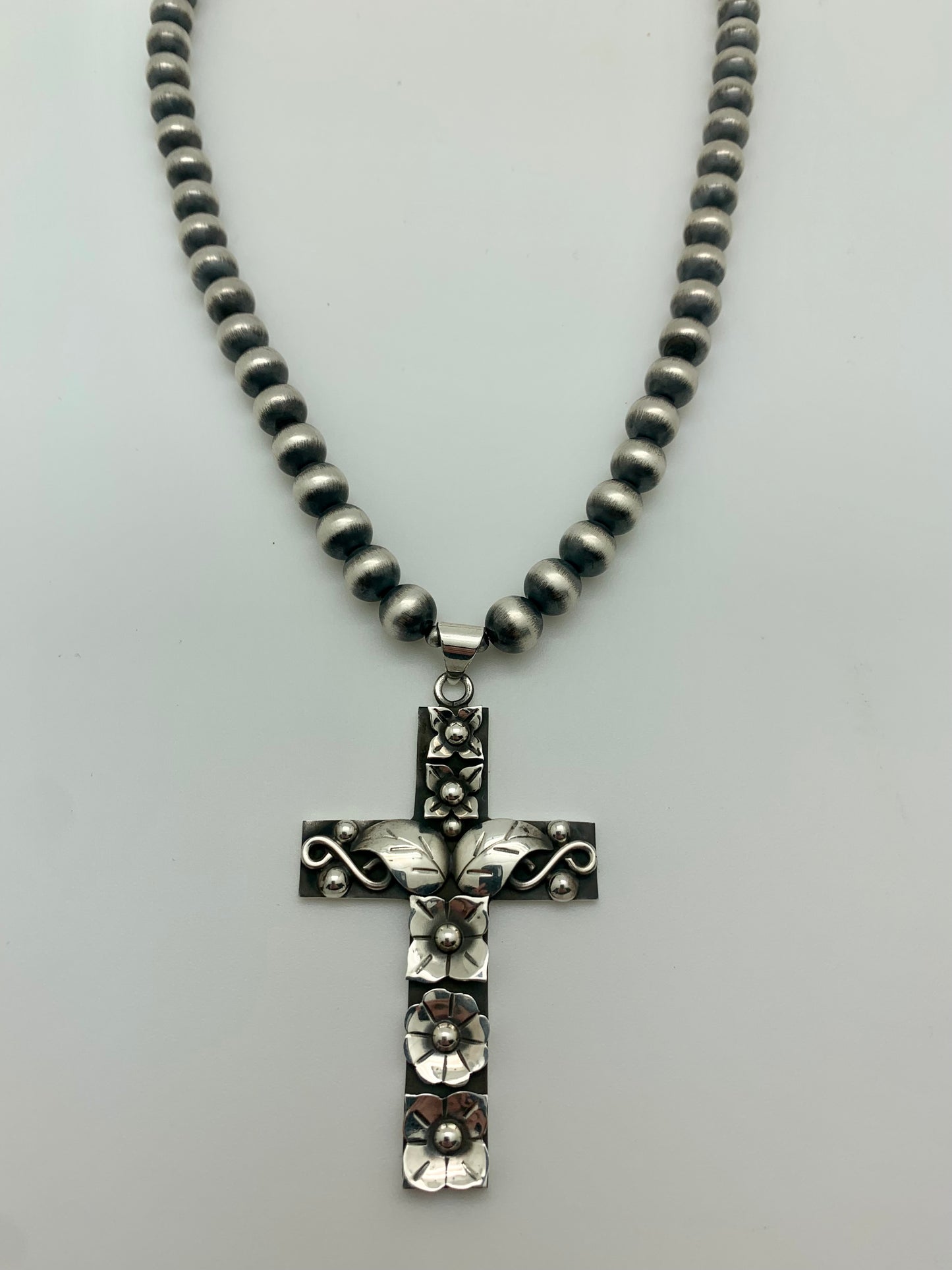 Sterling silver cross on Navajo pearls