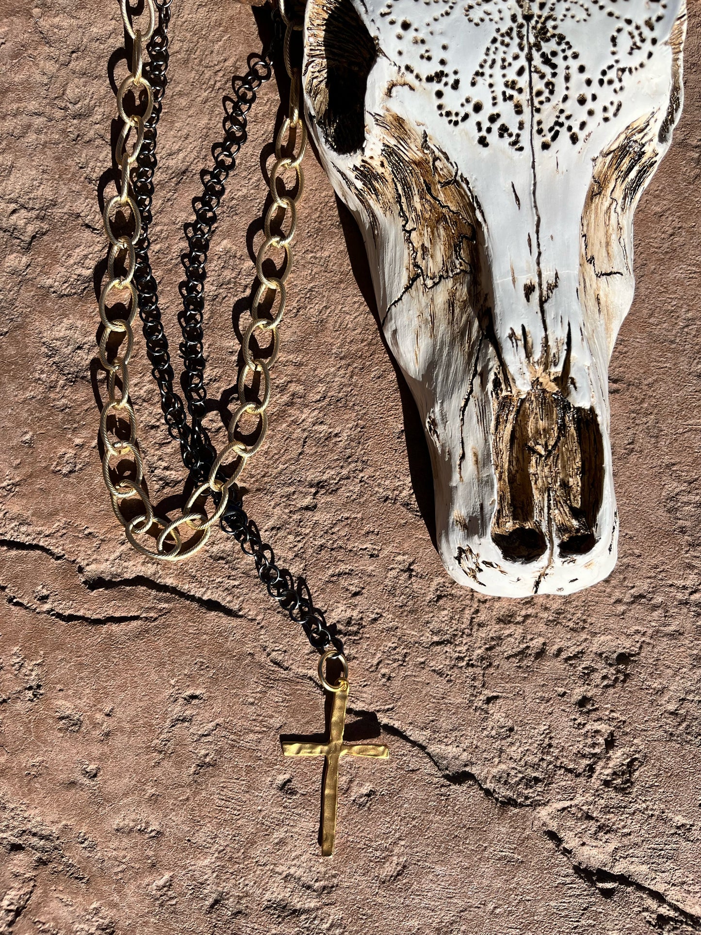 Long gun metal chain with skinny gold cross