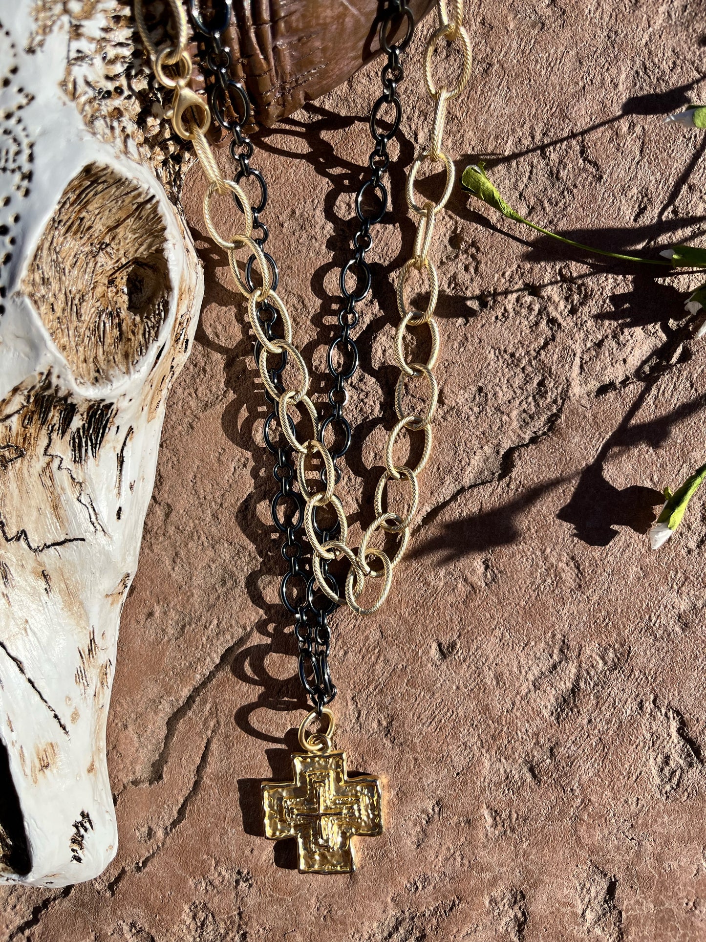 Gun metal chain with large gold cross