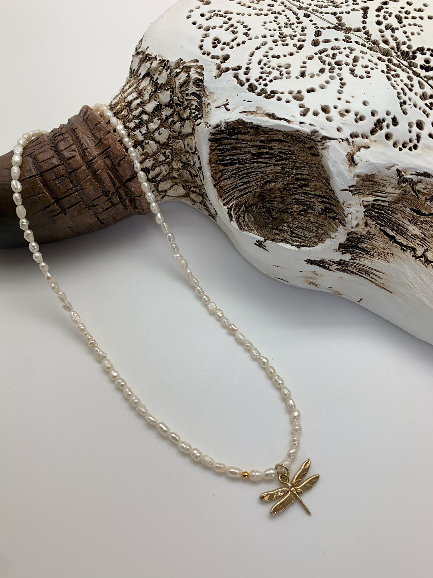 Small white pearls with mini dragonfly