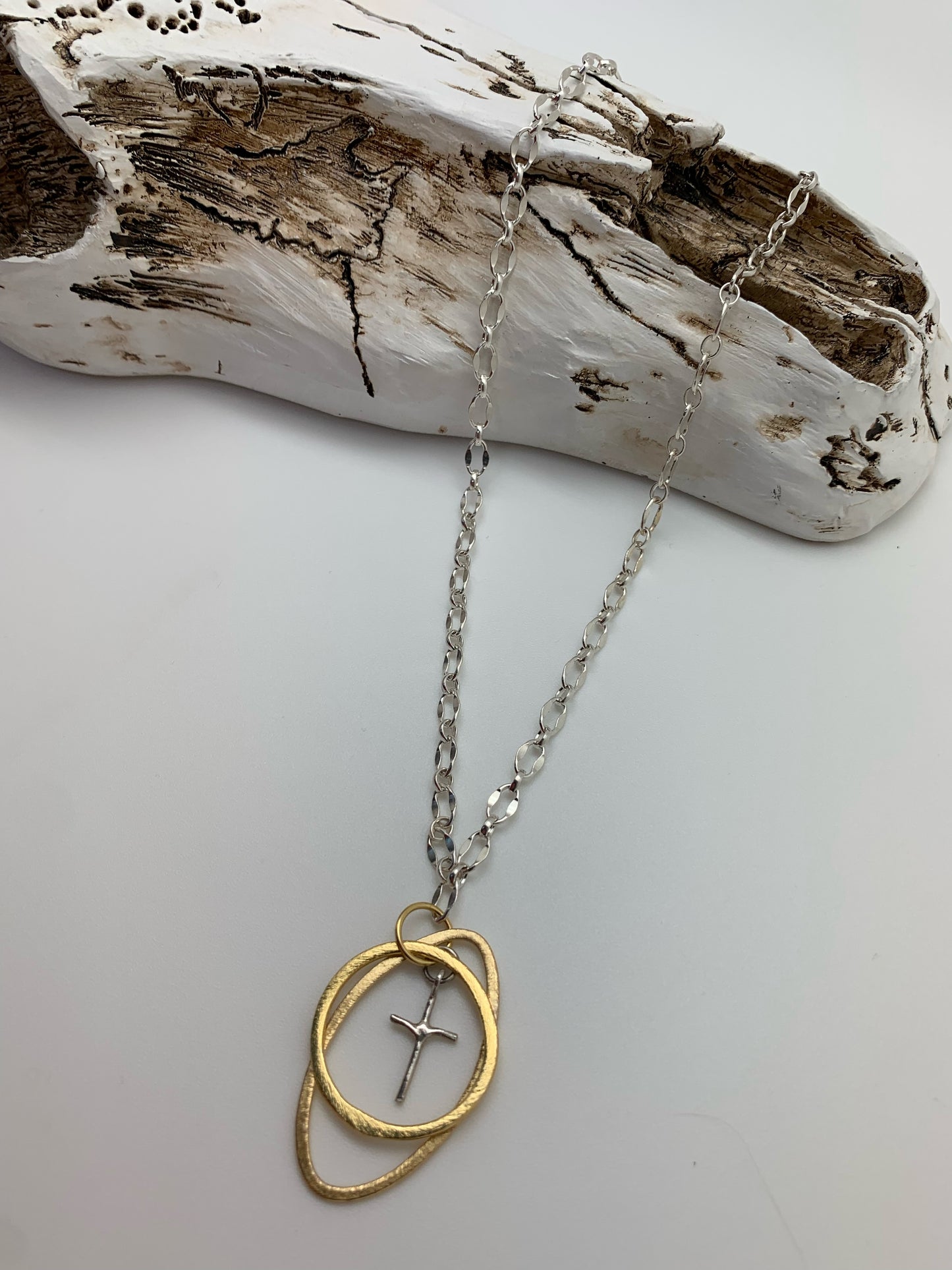 Sterling silver chain with gold hoops and silver cross