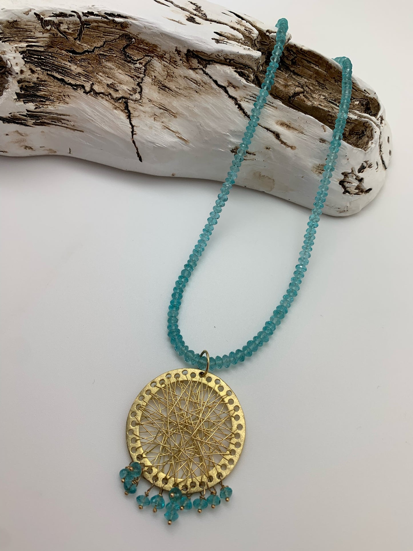 Clear turquoise beads with gold dream catcher