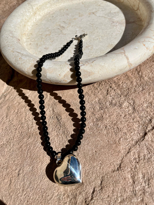 Black onyx necklace with puffed silver heart pendant