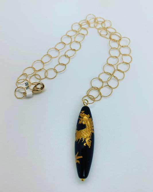 Gold loop chain with onyx and gold dragon