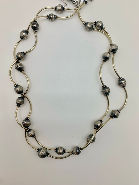 Navajo pearls on arched tubes