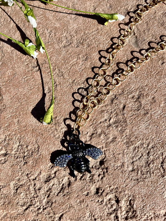 Gold chain with black bee
