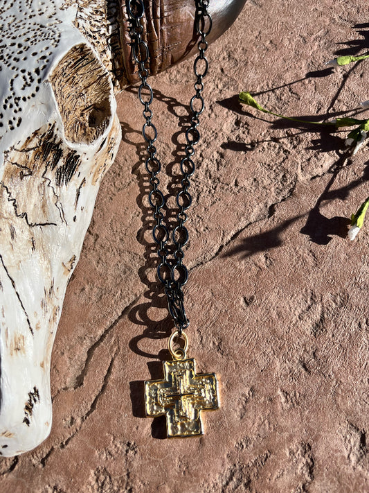 Gun metal chain with large gold cross
