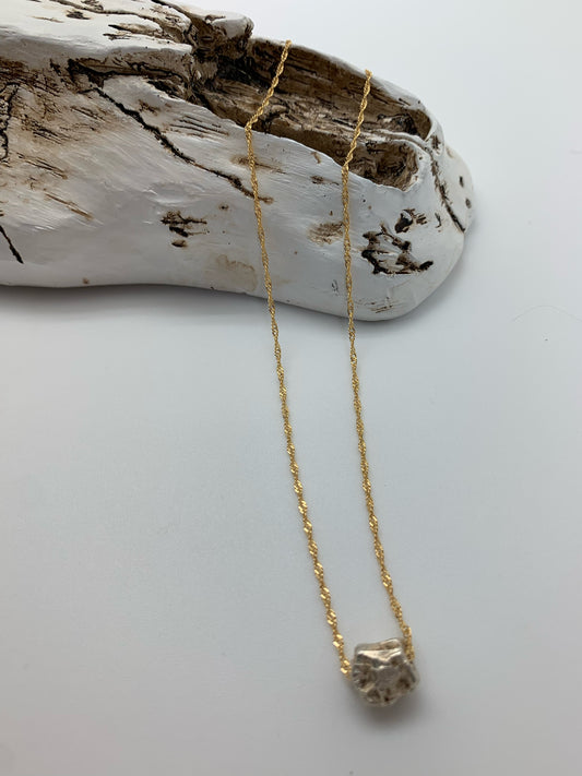Dainty gold chain with silver rock